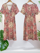 the FADED BOHO - Women's Bohemian Floral Print V-Neck Maxi Dress - Short Sleeve, Casual & Elegant for Vacation or Outing, Pink with Yellow & Blue Accents, Polyester Blend, Lightweight & Flowy Design