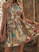 the DESERT BOHO - Women's Paisley Print Halter Dress with Adjustable Drawstring Neckline, Off-Shoulder Design, Vibrant Teal Blue & Beige Floral Print Pattern, Lightweight Polyester Fabric, Perfect for Spring/Summer Vacations, Cute Dresses