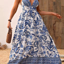 the BLUE PORCELIAN BOHO - Women's Floral Print Maxi Dress | Deep V-Neck with Crisscross Straps | Polyester, Non-Stretch Woven Fabric | Elegant Blue and White Flowy Design for Spring/Summer | Machine Washable | Perfect for Vacation & Casual Outings