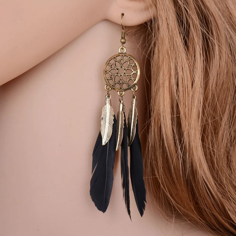 the BOHO DREAM - Hollow Vintage Leaf Feather Drop Earrings, Bohemian Feathers Long Design Hollow Metal Earrings, Ladies Jewelry