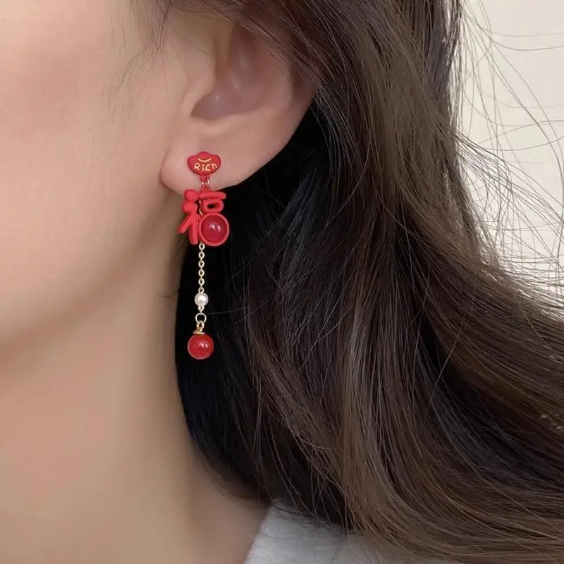 the GOOD FORTUNE - Chinese Style Red Little Lion Bell Pendant Earrings for Women, The Year of The Dragon Festive Jewelry Gifts