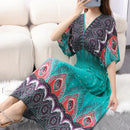 the TIBET BOHO - Casual Elegant Retro Bohemian Style V-Neck Elastic Waist Large Swing Printed Summer Long Skirt Dress for Women