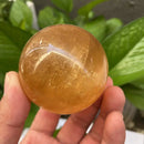 the CITRINE CALCITE - 1PC Natural Citrine Calcite Quartz Crystal Sphere Ball, Healing Gemstone Home Decor + Wood Bracket