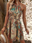 the DESERT BOHO - Women's Paisley Print Halter Dress with Adjustable Drawstring Neckline, Off-Shoulder Design, Vibrant Teal Blue & Beige Floral Print Pattern, Lightweight Polyester Fabric, Perfect for Spring/Summer Vacations, Cute Dresses