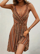 the BRONZED BOHO - Chic Boho Chic Cross-Front Allover Print Cami Dress - Sleeveless, V-Neck, Polyester, Machine Washable - Perfect for Summer Vacations