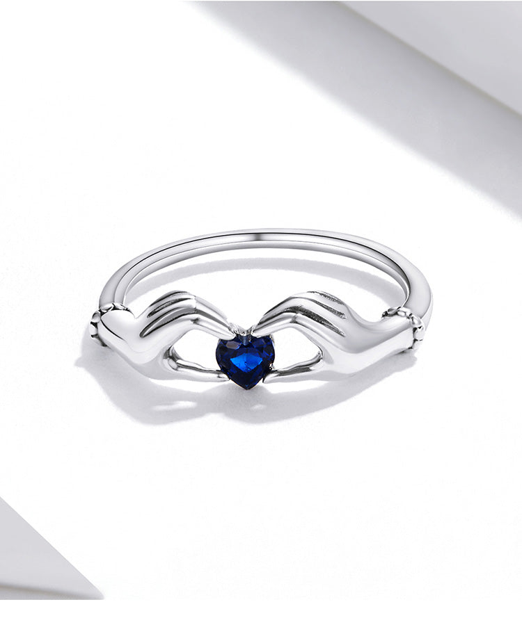 the HANDS OF LOVE RING - 925 Sterling Silver Love with Hands Eternal Heart Blue Gem Rings