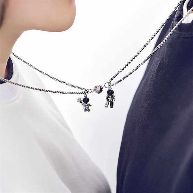 the MOON MAN LOVERS - Unique Astronaut Love Heart Magnetic Necklaces