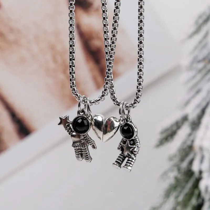 the MOON MAN LOVERS - Unique Astronaut Love Heart Magnetic Necklaces